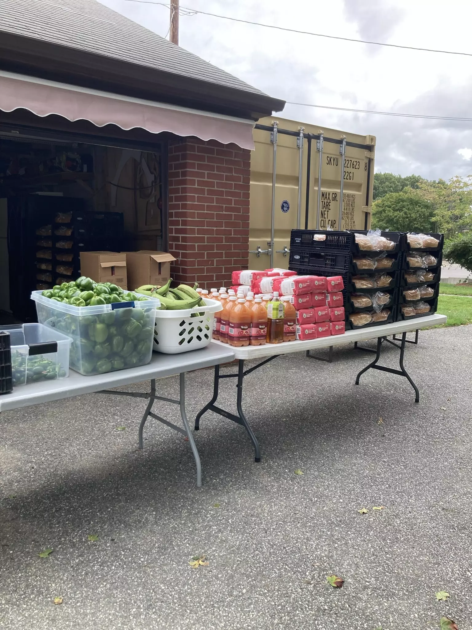 2 folding table filled with food ready to be served to the homeless in Providence RI